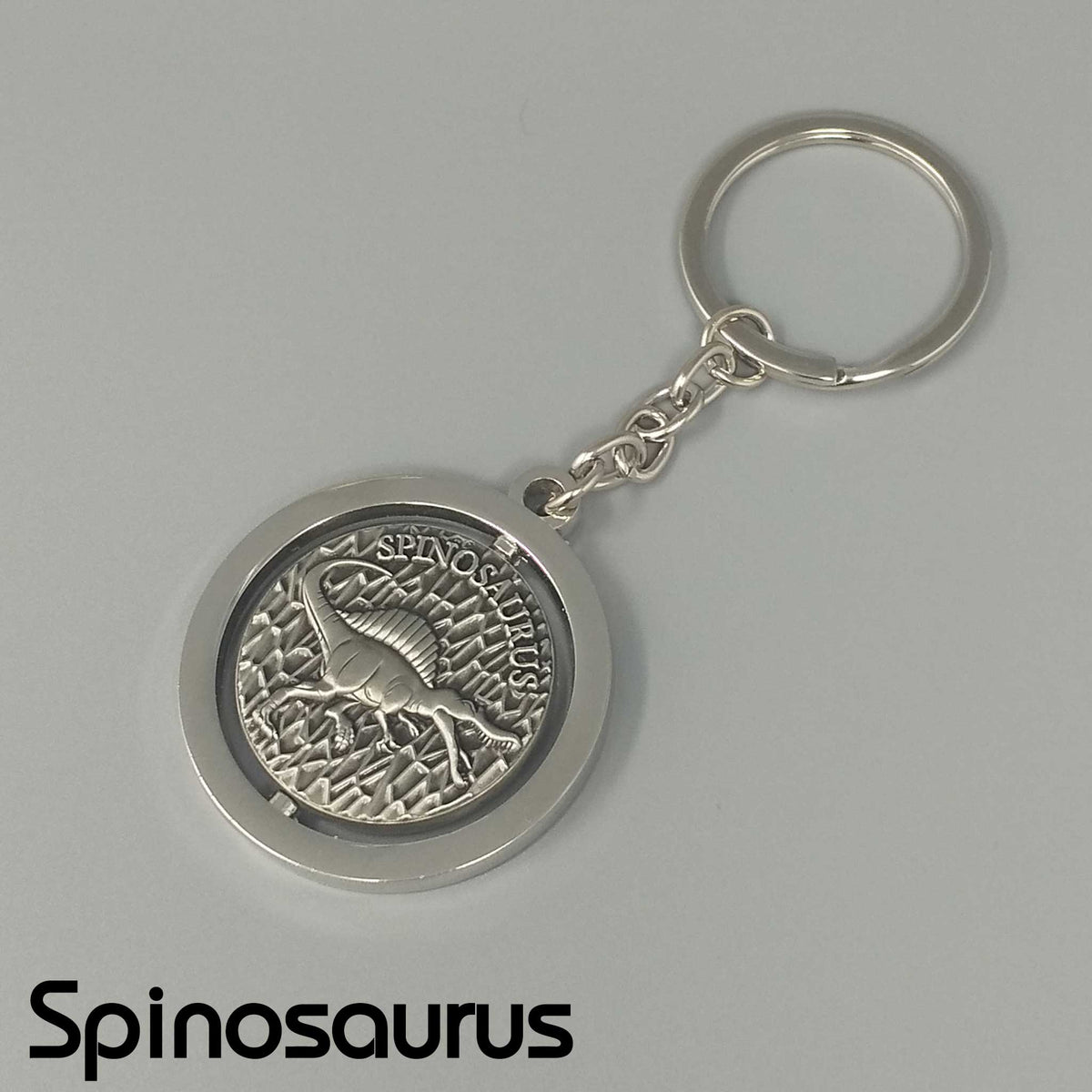 スピノサウルス スピニングキーホルダー｜メダルがくるくる回る 